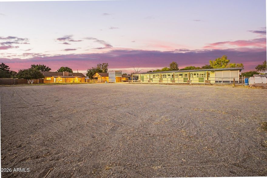 Fully Irrigated horse property with NO HOA + Detached Casita. Equestrian setup includes MD Barns 5-stall barn with mats, automatic waters, fans and pens. 3 tack rooms and a well-maintained arena with quality footing and irrigation-fed dust control system. Irrigated lot keeps costs down, with ample trailer parking and direct access to a bridle path connecting miles of riding trails. The main home offers 3 bedrooms, 2 bathrooms, vaulted ceilings, new flooring and an open great room with wood burning fireplace and natural light. Master suite opens to an extended covered patio overlooking the property. Furnished casita is ideal for guests, multigenerational living, office, or income potential.  Property also includes citrus trees, chicken coop, workshop shed,2 car garage with built in cabinets Complete Ring security system covers the barn, arena and the home for your protection and to watch riding tapes in order to improve.