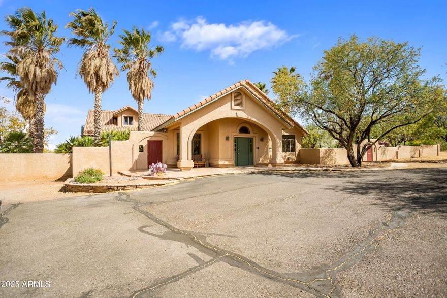 Recently updated and move-in ready, this exceptional estate blends spacious country living with the convenience of being close to town. Set on an expansive 4.25
acres, the property features 4 bedrooms, 4 bathrooms, a 3-car garage, and fresh interior paint throughout. Enjoy breathtaking mountain views from beautifully designed courtyards, patios, and outdoor living areas that invite you to relax in nature. A private well adds self-sufficiency, while the charming, full-size horse barn with corral is a rare and valuable bonus for equestrian enthusiasts or those looking for space to customize! The barn also features a caretaker live in area, 1.5 baths, a workshop area and a loft.  This special property has all that you need!