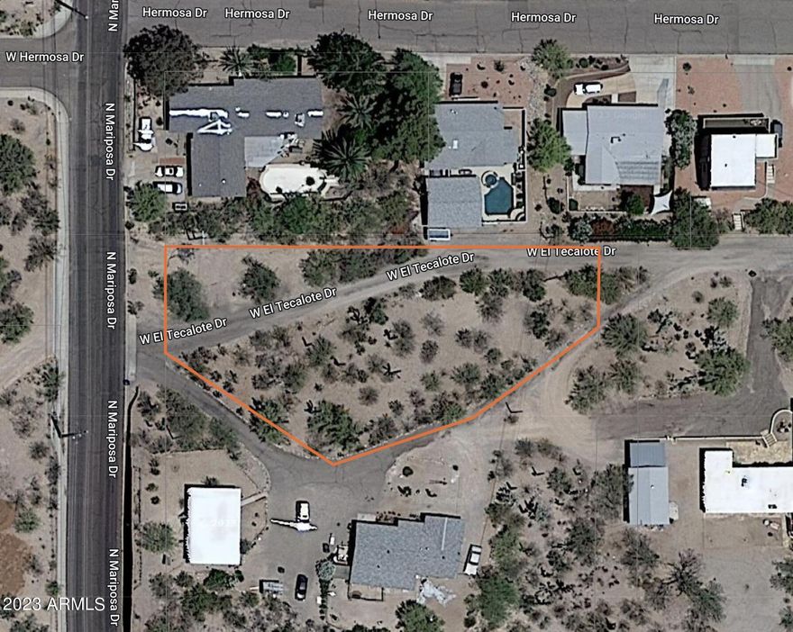 Located in the growing and desirable community of Wickenburg, it offers the potential for building a new home or a pre-built fab home.  Don't miss this opportunity to live in desirable ''Mariposa Heights''!  Raw land nestled on an interior, private lot. It is oversized with over a half acre, blank canvas ready to build your dream home!  Water, sewer and electric on property!  Setbacks - 20' frontage (West), 25' (East), 6' (sides).  All information listed to be verified by buyer.