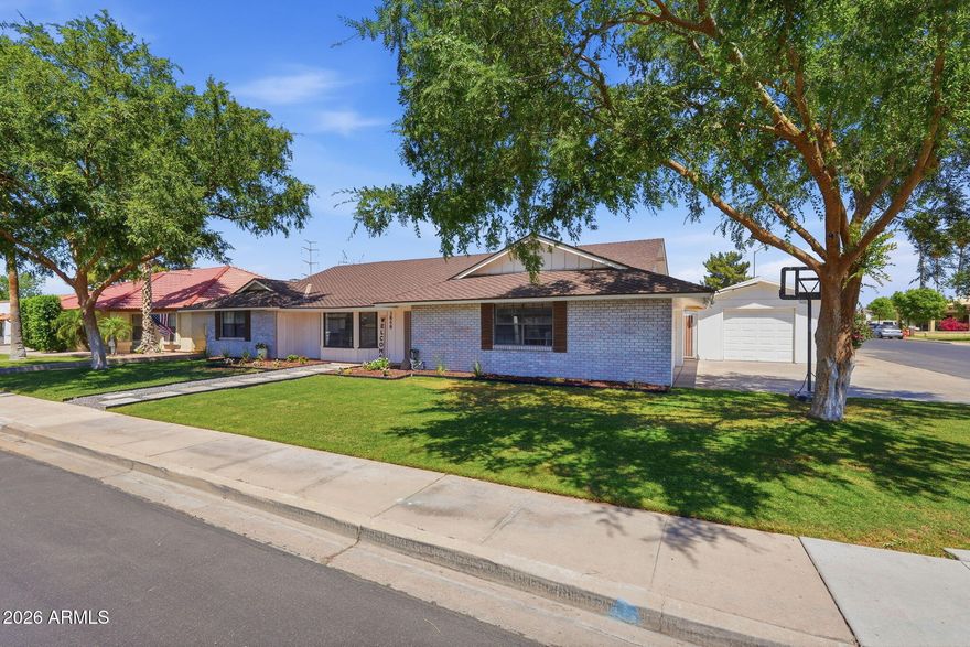 Charming, updated, and full of personality. Set on a picturesque South-facing corner lot in the heart of Mesa, this single-story, open concept home blends timeless feel with modern touches--think a fully remodeled kitchen, new flooring, gas fireplace, and a beautifully updated primary bath. The split floor plan offers 4 bedrooms and 3 baths (including a pool bath), plus a hidden bonus room that's just waiting to become your favorite office or the kids' ultimate play space. Outside, enjoy a beautiful brick paver patio, sparkling pool with new gate, and space made for gathering. With a detached workshop, extra storage throughout, laundry with sink, and no HOA--this one just feels like home.