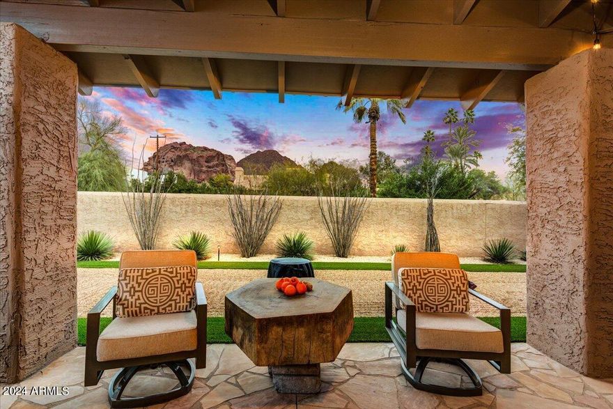 This home is perfect! Remodeled  in 2022 by the owner this is a 3 bedroom, 3.5 bath home with an office or convert the office into a 4th bedroom.  All of the main rooms have stunning forever Camelback views. Luxury abounds with a floor to ceiling limestone fireplace in the great room and separate family room, a  limestone primary bath (heated flooring) with full  wheelchair access into the bath areas. The  kitchen enjoys a soft white neutral palette with a cozy breakfast area leading to the outdoors. All rooms have access to outdoor spaces with a large covered patio, fire pit and BBQ. A short distance to the airport,  the location is outstanding as  you can walk to the new Global Ambassador Hotel, food shopping and multiple restaurants as well as the Village Health Club. Enjoy life !!