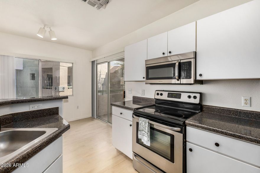 Enjoy owning this newly renovated unit nestled in the popular Ikon Hayfield Community! This upper-level gem features 2 bedrooms and 2 bathrooms. Check out the inviting open floor plan where comfort meets convenience. Highlights include wood-look flooring, fire sprinklers, fresh paint, ceiling fans, and abundant natural light. The kitchen features stainless steel appliances and plenty of cabinet space. The impeccable primary bedroom offers sliding glass doors that open to the balcony, a private bathroom with a glass step-in shower, and a walk-in closet. Spend relaxing afternoons sipping a refreshing drink on the cozy balcony, or take a quick dip in the community pool. Location Perks Just 1 mile from downtown Gilbert, close to shopping, dining, and entertainment. This turn-key home is the one!