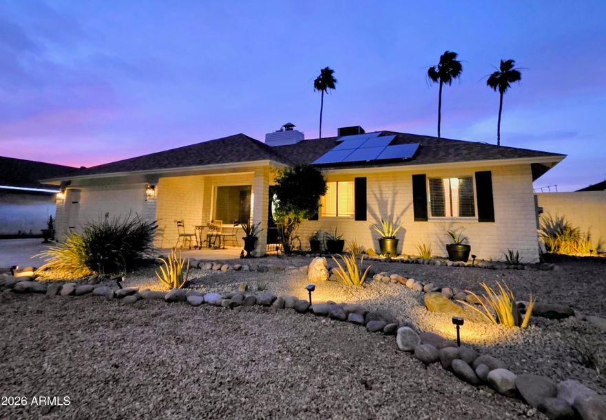 Welcome to this beautifully updated North Mesa home where clean design, thoughtful upgrades, and effortless indoor-outdoor living come together. Located in the highly sought-after Candlelight Estates community, this property offers a rare combination of walkability, flexibility, and curb appeal in a desirable, established neighborhood.

From the moment you arrive, the freshly painted exterior, bold black accents, and curated desert landscaping create a striking first impression. Inside, you're immediately welcomed by a stunning two-way fireplace that anchors the main living spaces. The bright, open layout features seamless luxury vinyl plank flooring, a fully remodeled kitchen with quartz countertops, custom cabinetry and premium Bosch appliances. The home has been meticulously updated with fresh interior paint, upgraded fixtures, and a newer roof, creating a clean, move-in-ready feel.

The expansive Arizona room offers versatile bonus space perfect for entertaining, highlighted by a luxurious vanishing wall of glass that opens to the backyard and new paver patio, creating a bright, seamless indoor-outdoor living experience. The backyard is designed for easy living, featuring a private pool, mature flowering trees, and lush grass. A tucked-away garden area adds a charming touch, perfect for those who enjoy fresh herbs, flowers, or a bit of outdoor creativity.

Walking distance to top-rated schools, Candlelight Park, and a nearby golf course, this home combines convenience with a true neighborhood feel, all while being just minutes from shopping, dining, and freeway access. Additional features include no HOA, an RV gate with extended driveway, paid-off solar for energy efficiency, and an oversized lot with multiple usable outdoor areas. 

Don't miss this rare opportunity to own in Candlelight Estates.

Professional photos coming soon.