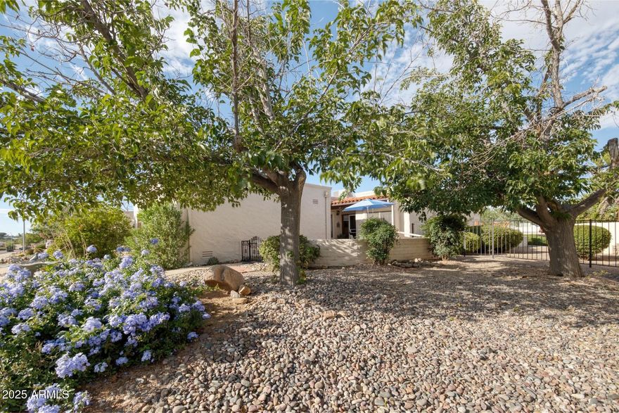 Beautifully maintained 2 bedroom, 2 bath townhouse in a desirable central location. This inviting home features a large living area with a cozy wood-burning fireplace, a friendly kitchen, and rich real wood doors and baseboards that add warmth and charm. Enjoy both front and back patios for relaxing or entertaining. The community offers a sparkling pool, soothing spa, BBQ area, and restrooms—all just a short walk away. Comfort, quality, and convenience in one perfect package!