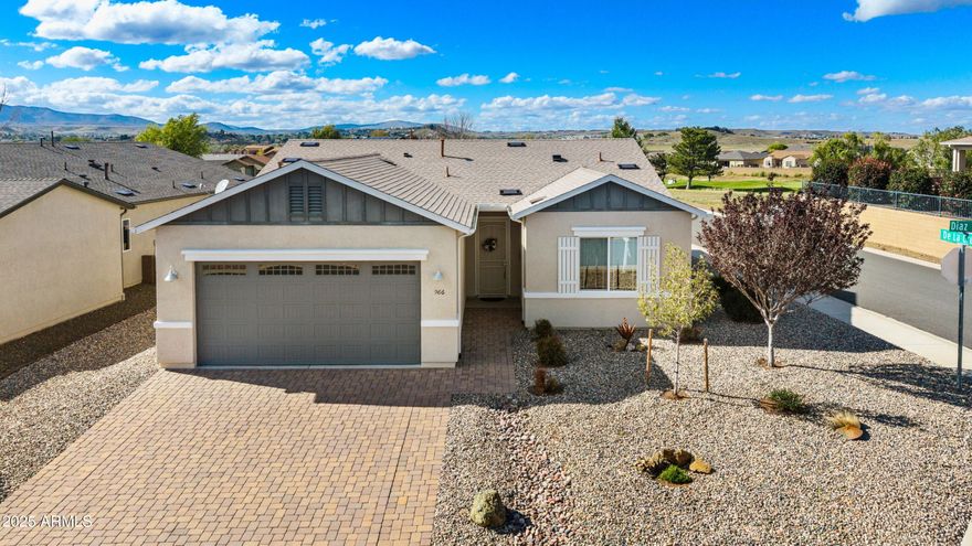 Fantastic Home on a .16 acre/Corner Lot in Quailwood backing VACANT Common area with Golf Course & Mountain VIEWS!!!  Home has 1492 sq ft, 3Bedrooms/2Bathrooms/2CarGarage, Great Room Concept, Ceiling Fans, attractive 12'' Tile and Neutral Carpet throughout, Pleated Levolor Shades, and upgraded lighting.   Kitchen is well appointed with Maple Cabinetry, Soft Close Doors/Drawers, GRANITE Countertops, White Appliances (Inc. Fridge), ISLAND Sink, Breakfast Bar, Large Pantry, & Breakfast Nook.   Master is Spacious, has Dual Sinks, Tub/Shower Combo, & Walk-In Closet.   Additional features include Lg Laundry Room with Washer & Dryer, NEW Roof October 2025, New Exterior paint Jan 2026, Paver Driveway/Walkway, Covered Patio + Extended Open Patio, Fenced Back Yard with VIEW Fence to enjoy the... Bradshaw Mountains and Golf Course Views, Superior Landscaping, & is in Turn Key Condition!!!!