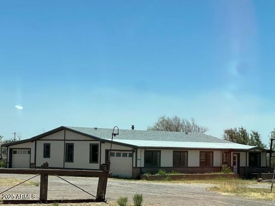 HUGE PRICE REDUCTION! Great investment property! Mountain views with easy access to Bisbee and Sierra Vista. Manufactured home partially renovated with additional home and and commercial building on the premises. So much potential!
