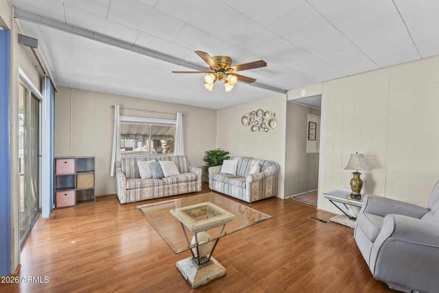 Adorable three bedroom home in the gated, active adult 55+ community of Trail Riders Ranch! This spacious home boasts a backyard for unwinding, with beautiful mature citurs trees! Make friends with neighbors at community events, and unwind at the sparkling community pool and spa! This corner lot allows for privacy and serenity! Welcome home!