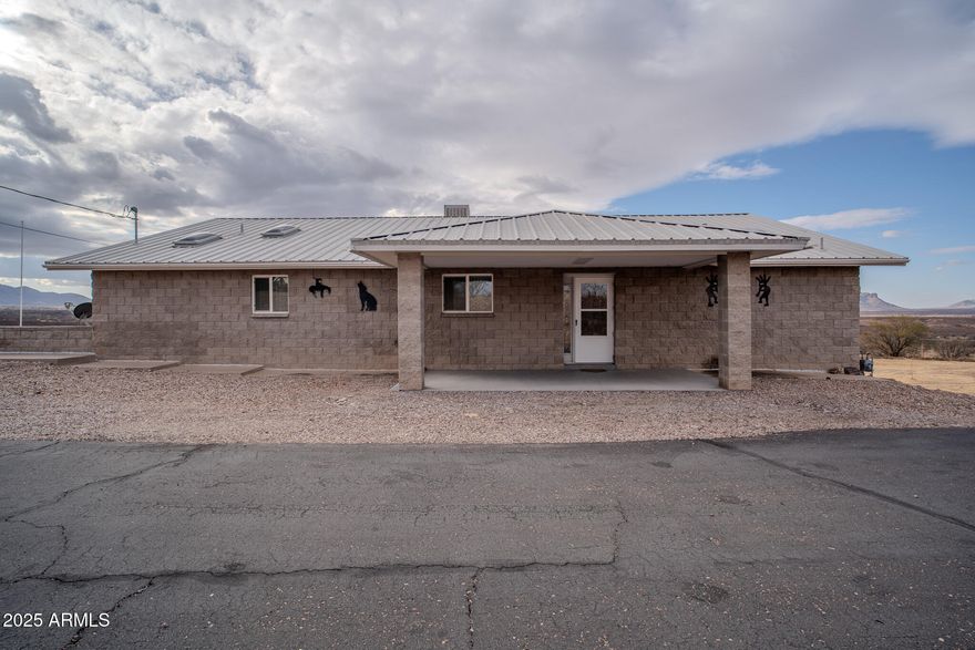 Do not miss out on this incredible house! 2 bedroom and 2 bath house has a fully heated and cooled Arizona room upstairs and fully heated and cooled workshop downstairs! Plenty of room to additional bedrooms! Oversized garage and a 5 bay carport under the balcony offers plenty of space for any car enthusiast! RV parking with hook-ups is great for company. You will be amazed by the breathtaking views from your covered balcony! This home has been meticulously well maintained by just ONE OWNER! In the heart of Huachuca City you are only minutes from shopping in Sierra Vista.