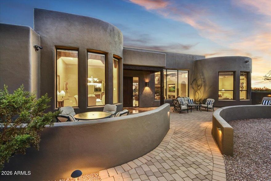 GOLD CANYON CUSTOM HOME - Set on an acre dotted with majestic saguaro cacti, this exceptional custom home offers refined single-level living in the Sonoran Desert, an ideal winter retreat from cold northern climates. Oversized windows perfectly frame breathtaking Superstition Mountain views from the living room, dining room, and guest bedroom, filling the home with natural light, warmth, and dramatic scenery. To the south, enjoy golden sunsets and sparkling city lights, all captured from the expansive rooftop deck with panoramic views in every direction. Designed for seamless indoor-outdoor living, the backyard is a true Arizona oasis featuring a swimming pool, fire pit, built-in BBQ, and outdoor shower—perfect for relaxed afternoons and evenings spent under clear desert skies while others are shoveling snow.

The chef's kitchen is both functional and elegant, featuring rich cherry cabinetry, granite countertops and backsplash, double ovens, an island with prep sink, and a walk-in pantry. The covered patio is already plumbed for an outdoor kitchen, making al fresco dining easy, while motorized screens provide shade and comfort year-round. Below, the private lower lot invites cozy evenings around the firepitperfect for s'mores under the Arizona stars.

The primary suite is a true retreat. Wake slowly and savor your morning coffee from the built-in coffee bar with sink and mini refrigerator, then relax beside the suite's second fireplace. The spa-inspired bath offers a soaking tub with a view, dual vanities, and a spacious walk-in closet with a convenient pass-through to the laundry room. Just outside the suite, a dedicated pad and wiring are ready for a hot tubideal for cool desert evenings.

The office is thoughtfully designed for both productivity and relaxation, with Flat Iron and pool views, built-in desks, and custom walnut cabinetry. An added luxury is the two-person infrared sauna, which conveys with the homeperfect after a day of hiking or golf.

Furniture is available and negotiable, allowing for a seamless, lock-and-leave transition (wood tables and art excluded). Custom iron art sculptures throughout the yard are included, adding character and a true sense of place.

The expansive double-bayed garage accommodates up to four vehicles. The oversized second bay features 12-foot ceilings, a 10-foot-tall by 18-foot-wide door, utility sink, and a dedicated alcove for workbenches or storage. Conveniently located near the outdoor shower, this spacecurrently used as a woodworking studiooffers exceptional flexibility for hobbies, recreation gear, or collector vehicles.  Buyers to verify with the HOA, but the lot may allow for the addition of an RV garage for those seeking expanded storage or future customization.

Located within Superstition Highlands, a community of stunning custom homes nestled alongside the Tonto National Forest, residents enjoy direct access to 2.9 million acres of protected wilderness for hiking, exploring, and embracing the outdoor lifestyle year-round. Despite the peaceful, uncrowded setting, everyday conveniences are close at hand: Private Superstition Mountain Golf & Country Club is just 6 miles away, Canyon Lake is 17 miles away, Banner Gateway Hospital is 16 miles away, San Tan Village shopping and dining is 20 miles away, Mesa Gateway Airport is 13 miles away, and Sky Harbor International Airport is approximately 31 miles away.

This is luxury desert living designed for those seeking sunshine, space, and serenityfar from winter cold, yet close to everything that matters.