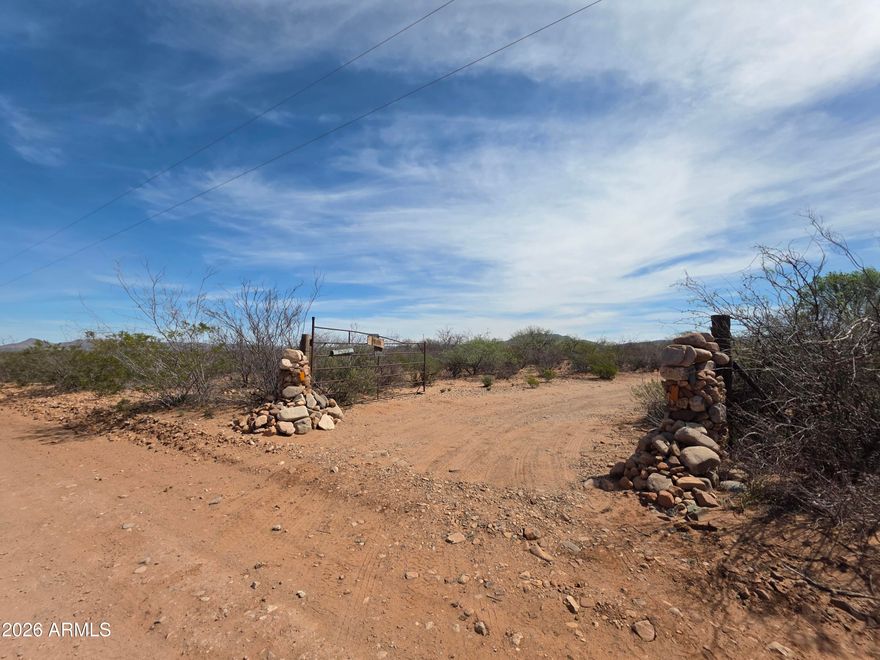 Set on 4.397 acres of private, secluded desert landscape between Sierra Vista and Bisbee--near the San Pedro River--the property features a 1981 mobile home with a 1996 addition totaling approximately 1,495 sq ft. The home requires major repairs and is being sold as-is, making it ideal for those ready to take on a project or start fresh.
Beyond the structure, the true value lies in the land and its story. The seller deeply loved this property, spending countless hours walking the land and surrounding area, Over time, pieces of the past revealed themselves--arrowheads, petrified wood, and other natural treasures--adding to the character and connection this land offers. Private well approximately 100 yards from the home
Shed & multiple outbuildings with potential for storage or workshop use-Large rock chiminea for peaceful desert evenings-
Mature trees, ocotillos, & creosote showcasing the natural desert beauty *Minimal land maintenance aside from cleanup
if you're looking for your next project or seeking land with meaning & history, this property offers a rare opportunity to create something new while honoring what once was. Sold as-is. Bring your vision & make it your own desert oasis.