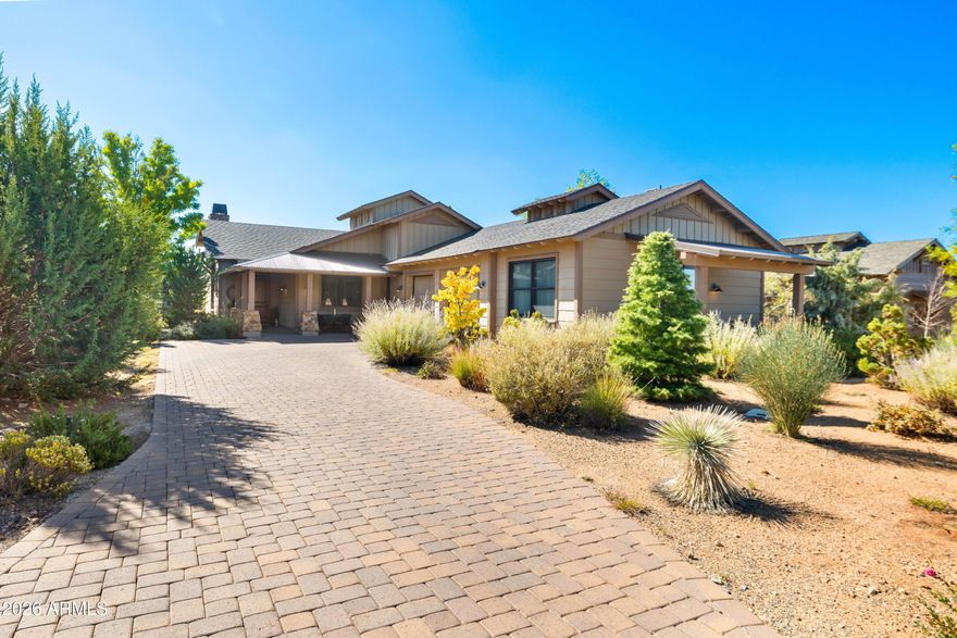 Stylish ranch cottage in a prime golf course location by the second green. Alfresco living on 4 terraces: south facing covered back patio that's shaded in Summer yet sunny in Winter, extended flagstone patio surrounded by fragrant creeping thyme and organic firepit, covered front patio and private casita patio. Mature trees allow you to enjoy privacy on back patios while enjoying views of the golf course.
Open design concept ensures a seamless flow of space and large windows and doors throughout provide welcome natural light. This floor plan offers 3 beds, 3 baths plus an attached 1-bed, 1-bath casita with private entry.
Classic travertine floors, neutral walls, brie color top tier cabinetry and timeless stone fireplace complement transitional and contemporary design.
