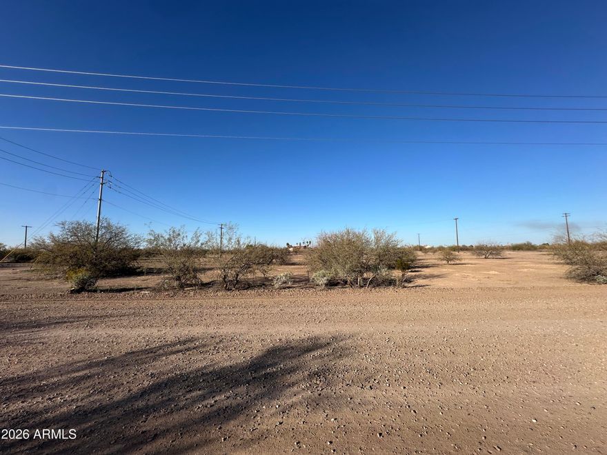 Great Views! Commercial Property, Zoned C-2. Close to Toltec Elementary School, Restaurants, Hotels, Gas stations & Truck stops. Elementary & Jr. High School across the Street. City Of Eloy for water & trash services. APS for Electric. No Utilities to property. Water Main is 102 feet away. Closest Fire Hydrant is 316 feet away. No sewer main nearby. Septic authorized. Once sewer lines are extended to area, property owner must connect to the City of Eloy sewer system and abdndon septic. Close to Robson Ranch and Dollar General. Great Mountain views, Accessible to I-10 & I-8. See uses, zoning and available utilities on Document tab.
There are 2 other parcels that adjoin this property. Total of 3 lots can be sold together. Sold separately.