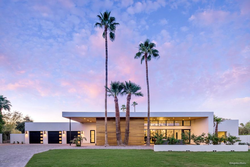 300K PRICE REDUCTION. NOW PRICED TO SELL! Welcome to Modern Luxury at it's best. This newly completed, custom build is located on a 1.56-acre lot at the end of a quiet cul de sac. Enclosed by handcrafted steel fencing and private gates both front and rear, with an eight-camera security system to further enhance privacy and security and a complete audio video package.

Stunning front elevation and pavered entrance lead to the dramatic indoor/outdoor foyer. Beyond the foyer, you're greeted by a gourmet kitchen with extensive butlers pantry as well as enormous, high ceiling great room/dining area featuring a rolled steel fireplace. Distinctive interior finishes by StudioDwell are carried throughout the residence and lend a feeling of casual elegance to the home. The 845 SF  Excercise/Game Room is separated from the beautifully designed media room by a custom fenced dog run covered in turf with an outdoor bathing facility for the extended family. In addition to the detached casita, there is a large guest suite with full bath in the main house. There is also a private massage room and a mud room off the four-car garage.

Just off Scottsdale Rd, the location is one of the best in town. A stone's throw from Scottsdale Fashion Square and Old Town, convenient to the 101, and easy access to the Scottsdale Canal for walking or biking from home to Old Town and Arcadia. The property also features two stalls and a wash rack for horses.