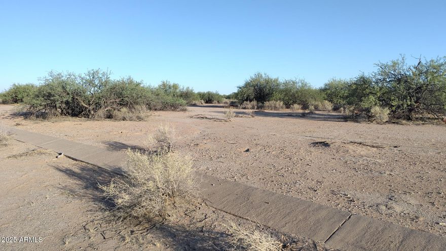 A GREAT INVESTMENT!!!  
Cozy lot tucked deep in the Desert Carmel subdivision!  As the city of Casa Grande continues to develop westward, this property will make a great homesite, far away from city traffic and commotion!