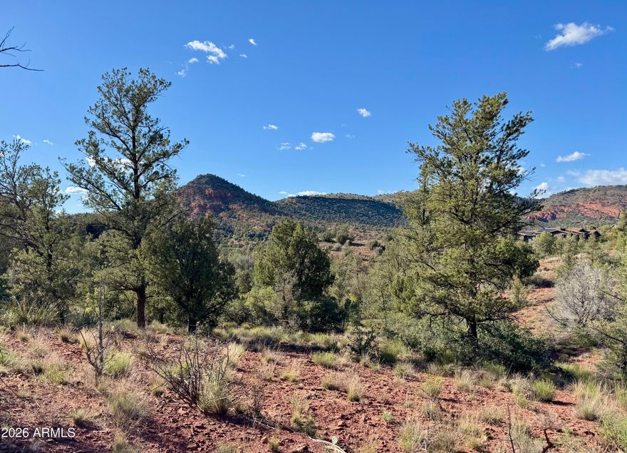 Experience the very best of Sedona living on this exceptional 2.03-acre luxury homesite. With a generous building envelope, this property provides the ideal canvas to design and build your custom dream home. Enjoy breathtaking views and the privacy of a quiet cul-de-sac, along with the convenience of easy access and underground utilities already in place.

Located within the highly desirable Cross Creek Ranch community - a truly remarkable neighborhood bordering Oak Creek, Coconino National Forest, and Red Rock State Park.

Arrive by crossing a scenic bridge over Oak Creek and enter through beautifully crafted gates that welcome you into a historic and serene environment. Residents enjoy private hiking trails, direct creek access, and an abundance of natural beauty at every turn. Surrounded by luxury estate homes and miles of scenic trails, Cross Creek Ranch offers a peaceful, refined lifestyle defined by tranquility and stunning surroundings. An Arizona State Park pass provides the added benefit of private gated entry into the adjacent nature preserve, opening the door to even more hiking, wildlife, and outdoor exploration.

One owner is a licensed Arizona Realtor.