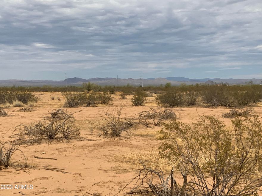 Beautiful 1 Acre Portion of parent Lot. Start your own homestead close to town but quiet with stars.   Escape to the country - but be minutes from the city. This is it!  Fully buildable lot (No APZ, No Noise Contours).  Bring the horses bring your toys.  Site Built or Manufactured Okay! 

Wittmann is located in an area of current rapid growth. Chip plant commuting distance. Located along US60 in the central part of Arizona, it is about 35 miles northwest of Phoenix. The nearby city of Surprise has, in recent years ,annexed much of the land near and around the town, and has included it as part of the city's general plan.