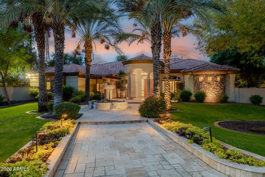 Welcome to one of the most extraordinary custom estates in Gilbert, Arizona. This highly upgraded Forte built residence offers resort-style living, unparalleled entertaining spaces, and a breathtaking backyard oasis built by Red Rock Pools and featured on HGTV and The Travel Channel. At the heart of this 1.2 acre gated property is a gorgeous 140,000-gallon swimming pool, featuring a 12-foot waterslide, grotto, elevated 15-person spa, kid pool, and separate adult and teen swim areas - creating a true private vacation retreat. The backyard also boasts two outdoor kitchens, an outdoor dining room with gas fireplace and two distinct outdoor living rooms. Putting greens sit adjacent to a private skate park near the rear of the lot, completing this one-of-a-kind outdoor experience. Guests will enjoy complete privacy in the 2400 sq. ft. detached guest house, which includes two bedrooms with two full bathrooms, a full wall of sliding glass doors with a view of the waterfall, a full kitchen, dining and living spaces, laundry room, and covered patio.

The main residence features a desirable split floor plan, anchored by a luxurious primary suite with fireplace, wood flooring and exquisite bathroom. Formal living spaces showcase a large bar area with backlit onyx wall, alabaster light fixtures, and granite countertops. The custom chef's kitchen is equipped with a Viking gas range and top-of-the-line appliances. Secondary bedrooms include one en-suite bedroom and two bedrooms with Jack-and-Jill bathroom, all with generous walk-in closets.
A three-car garage plus a two-car garage that has been converted into a private distillery and cigar bar, adding yet another unforgettable element to this showpiece estate.
Truly a once-in-a-lifetime residence designed to impress, built to entertain, and impossible to replicate.