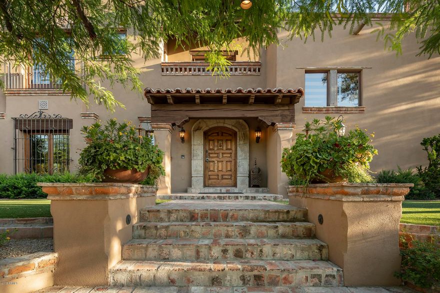 WELCOME TO PV HOLLYWOOD HILLS! This intimate and charming Jewel Box home is perched on a mountain with abundant outdoor spaces taking full advantage of expansive valley views. Entertain like never before in the sumptuous kitchen, extensive covered patios, private Ramada overlooking the pool & spa, PGA quality putting green and chipping area, sport court, and fully integrated Bang & Olufsen audio system. Enjoy the highest quality craftsmanship with pure, genuine, & masterful finishes, from the vintage ironwork imported from Mexican haciendas to the grand stone fireplaces all painstakingly & passionately fashioned by hand. Single level living with only a study, guest bedroom, & loft above. ALWAYS IN VOGUE a Spanish Colonial Masterpiece - unlike any other in Paradise Valley.