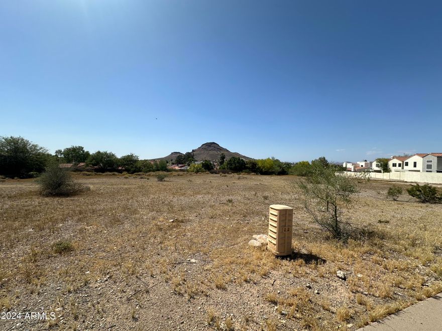 North Phoenix development on a rarely offered C-2 Zoned lot with frontage on Cave Creek Road. One of the last few vacant lots on Cave Creek Road can be yours. High traffic area along Cave Creek Road with numerous businesses and supporting residential including multi-family and luxury homes.  One of the most desirable Zoning Types, C-2 allows for tremendous flexibility and options for a wide variety of businesses! Mountain Views add to this amazing lot and all the options/opportunity! 
Close to Cactus Road, Greenway Pkwy and Bell Road, Loop 101 and SR-51 are also just 5 minutes away. Seller Carry or Joint Venture for the right buyer/opportunity.
Self Storage, Retail, School, Daycare, Automotive, Residential multi family, Office, Flex warehouse, so many options! Traffic Analysis
Cave Creek Road near this location (around the intersection with Loop 101/SR-101) sees high daily traffic, supporting the listing's claim of a "high traffic area." Recent data indicates an average annual daily traffic (AADT) of approximately 90,000-96,000 vehicles, making it suitable for businesses relying on visibility and foot traffic.
C-2 Zoning: Allowed Uses and Flexibility
Phoenix's C-2 zoning (Intermediate Commercial) is designed for a wide range of commercial activities, with many uses permitted outright or via a use permit. It emphasizes flexibility for businesses while requiring most operations to occur within enclosed buildings (except where specified). This aligns with the listing's highlights of "tremendous flexibility" for various options.
Key sections from Phoenix Zoning Ordinance Section 623:

Permitted Uses (outright allowed, including all uses from lower-density districts like C-1, R-3, R-4, R-5 for residential components):

Retail sales (e.g., antiques, architects' supplies, automobile parts, building materials, clothing, florists).
Offices and professional services (e.g., contractors' offices, dental labs, engravers).
Automotive-related (e.g., auto parts sales, seat covers/trim shops, rental with limitations).
Wholesale and storage (e.g., beverages, chemicals, dry goods, frozen foods, furniture repair/refinishing).
Multi-family residential (permitted as in R-3/R-4 districts, including apartments).
Educational and care facilities (e.g., schools, daycaresoften as accessory or with conditions).
Warehousing/flex space (e.g., bank vault storage, cleaning plants, contractors' supplies).
Other: Assembly halls, bowling alleys, car washes, family game centers, medical labs.


Uses Requiring Use Permits (conditional approval needed, often with site-specific reviews):

Auctioneers' auditoriums, bus terminals, exhibition halls.
Adult-oriented businesses (with strict location restrictions).
Outdoor activities or larger assembly halls (25,000 sq ft).
Compressed natural gas sales at service stations.
Certain manufacturing or processing (e.g., bakers' goods, bookbinders).


Accessory Uses (allowed secondary to primary uses):

Massage therapy in beauty shops.
Blood banks/plasma centers accessory to hospitals.
Outdoor dining or events (with permits in some cases).


Restrictions:

Most uses and storage must be within closed buildings.
No on-site maintenance/fueling for certain operations (e.g., auto rentals, bus terminals).
Distance requirements for sensitive uses (e.g., adult businesses must be 500-1,320 feet from schools, parks, residential zones).
Environmental/safety standards (e.g., non-combustible cleaning agents, no bottling for beverages).
Residential uses are permitted but must comply with multi-family standards from lower districts.



The suggested uses in the listing (self-storage, retail, school, daycare, automotive, residential multi-family, office, flex warehouse) are generally permitted or allowable with a use permit under C-2, confirming the "desirable" zoning claim.
Development Potential and Considerations
This lot's rarity as one of the few vacant parcels on Cave Creek Road, combined with mountain views and proximity to highways, positions it well for commercial or mixed-use development. High traffic could benefit retail or service-oriented businesses, while C-2's flexibility supports the listed options.