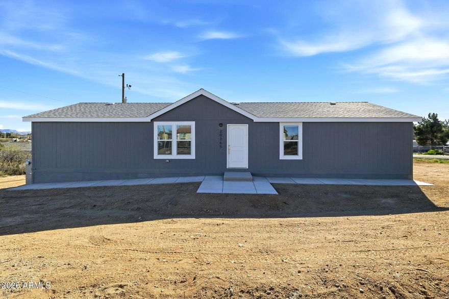 Welcome to this brand-new Cavco manufactured home located on a desirable corner lot in the heart of Cordes Lakes. This spacious four-bedroom, two-bathroom home offers a bright, open layout with plenty of room for comfortable living. Natural light fills the living spaces, creating a warm and inviting atmosphere that flows easily into the kitchen and dining area, making it ideal for everyday living and entertaining. The split-bedroom floor plan provides added privacy, with a generously sized primary bedroom featuring a nice sized walk-in closet and bathroom. Three additional bedrooms offer flexibility for guests, home offices, or hobbies, while the second full bathroom is conveniently located for easy access. Situated on a level lot, this property offers a true blank slate for the new owner's imagination. Whether you envision landscaping, outdoor living space, or additional features, there is ample room to create your ideal setting. Centrally located in Cordes Lakes, this home combines peaceful surroundings with convenient access to nearby amenities and major travel routes. This is a wonderful opportunity to own a new home with space, versatility, and endless potential.