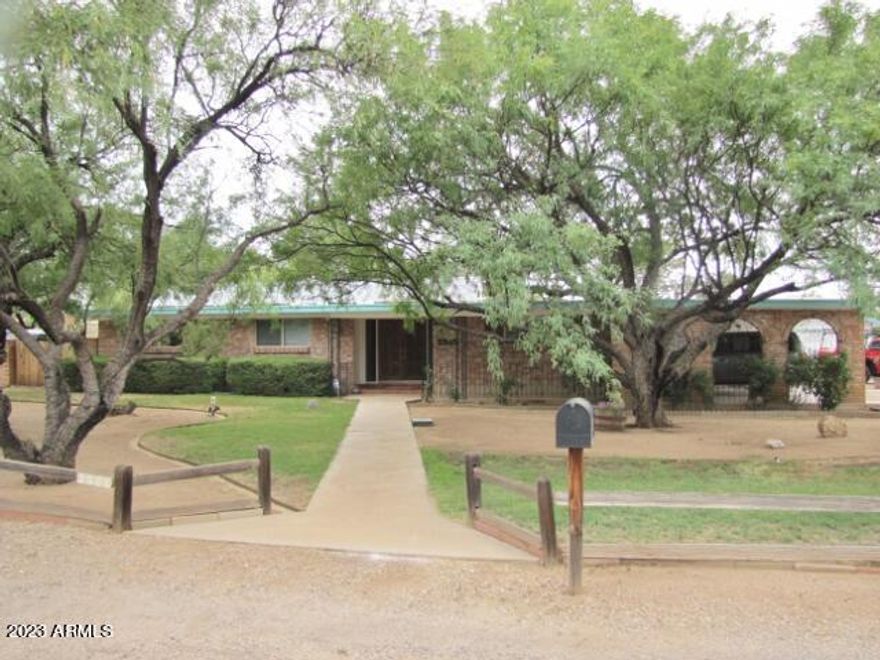 This spacious 3BR+den/2BA/1CG/2CP, 2416 sq. ft. home on .462 acre is centrally located in Sierra Vista, AZ minutes from Ft. Huachuca, shopping, schools & Canyon Vista Medical Center.  The floor plan includes 2 living areas, a formal dining room, wood-burning fireplace, central A/C, an Arizona room and walk-in tub.  The backyard has a in-ground swimming pool with cabana and the yards are landscaped to include a number of storage units.  Call today.