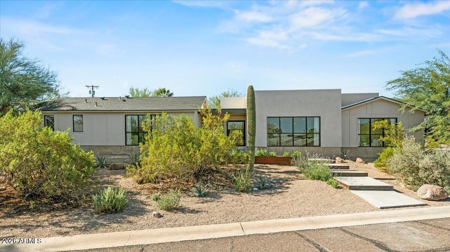Sitting on an elevated lot this sleek 2025 rebuild offers a cool, modern organic aesthetic that perfectly combines comfort, elegance, and design. The great room is a stunning space with built-ins, the open dining area with coffee bar is perfect for formal and informal gatherings, and the upscale kitchen has everything the aspiring chef could desire, including a 48'' AGA induction range, a panel-ready 48'' SubZero refrigerator, dual Bosch dishwashers, an appliance garage and huge double islands that offer endless entertaining options, tons of casual space for family gatherings, or a workspace for the kids. Contemporary finishes include sleek quartz countertops, custom cabinetry, super stylish lighting, wide plank wood flooring, oversized picture windows that shower the home with natural sunlight, solid core doors, and top of the line faucets and fixtures. The primary suite is super chic and includes a sitting area, a gorgeous primary bath with double vanities, lots of storage, large walk-in shower, separate soaking tub, and his and her closets. A Jack-and-Jill bathroom for the kids is beautiful and functional with double sinks and bathtub. A fully appointed guest house has its own entry or can be accessed through the main house which makes it great for a home office, guests, and a fantastic option for multi-generational living. A temperature-controlled garage equipped with EV charger adds convenience and functionality. The sustainable grounds house a lovely pool, mature landscape and offer exceptional mountain views. All located within walking or biking distance to Arcadia's favorite hotspots, Global Ambassador & within the coveted Hopi Elementary school district. This ultra styled home, in a highly coveted neighborhood, is for those who appreciate state-of-the-art architecture at its finest!