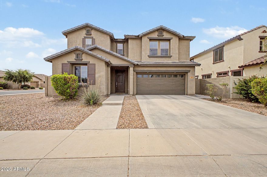 4-bedroom, 3-bath home with 2,404 sq ft, a 2-car garage, and a spacious loft, located in the desirable Lehi Crossing community and built in 2017 on a premium corner lot. Situated on a quiet street, this property offers the perfect blend of modern comfort, functionality, and Arizona outdoor living. Wood-look tile throughout and a light, open floor plan with generous living spaces ideal for both everyday living and entertaining. The kitchen is open to the family room and features dark maple cabinetry, a center island, granite countertops, and stainless steel appliances, creating a warm and inviting heart of the home. The split-bedroom layout provides privacy, while the oversized primary suite offers a relaxing retreat. The primary bathroom includes a separate tub and shower along with dual sinks for added convenience. Step outside to enjoy a private backyard with plenty of room to entertain, garden, or add your own personal touches. Located near top-rated schools, shopping, dining, and easy freeway access, this home combines convenience with a peaceful neighborhood setting--an excellent opportunity in one of Mesa's most sought-after communities.