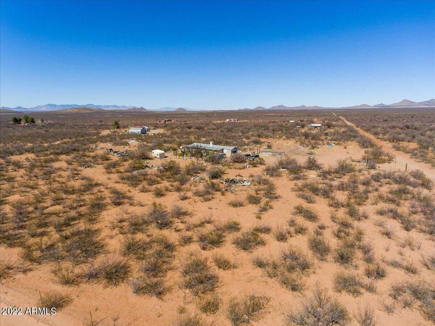 4 acres with all utilities on the property! 400 amp electrical, well share on property, septic installed. Propane available to be installed. This property has a home on it but is being sold as land and AS IS.