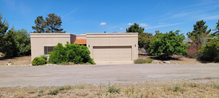 Here ia a rare opportunity to purchase a home on a smaller property in the beautiful city of Sonoita. This cute home features a lovely master suite with a huge walk in closet plus a standard closet. There is a sliding door to the covered patio in the backyard  that yiu will love. The master bath has dual sinks plus a garden tub and separate shower. The secondary bedroom is in front with wonderful natural light. There is a pretty open floor plan and the living room as a cute beehive fireplace. There is a formal dining room as well as a bayed breakfast nook and a breakfast bar off the kitchen. There is quite a bi of counter space and and cabinetry. There is also a light and sunny laundry room that you will enjoy. There is a deep garage with a storage area and a shower in the garage as well.