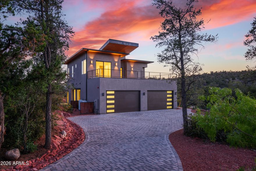 Stunning luxury home with unobstructed red rock views of Cathedral Rock in the prestigious Mystic Heights subdivision. Perched above Oak Creek and adjacent to National Forest, this 3,516 SF residence offers direct access to hiking trails and a rare blend of privacy, scenery, and convenience.
Situated on 1 acre, the home features 4 bedrooms, 5 bathrooms, and a 4-car garage. The open-concept floor plan is designed for seamless indoor-outdoor living, with expansive windows framing the surrounding red rock landscape.
The gourmet kitchen is equipped with top-of-the-line Thermador appliances, a large center island, and a custom walnut bar:ideal for both everyday living and entertaining. The primary suite offers a private outdoor retreat with hot tub & cold plunge. Upstairs, a spacious view deck captures panoramic red rock vistas. The outdoor terrace includes a built-in BBQ and gas firepit, creating an ideal setting for enjoying Sedona sunsets.

Located within walking distance to Oak Creek and nearby trail systems, and just minutes from Red Rock State Park, dining, shopping, and cultural amenities including the Sedona Performing Arts Center. High-speed Quantum Fiber internet (approx. 2GB per second download speed and close to 2 GB per second for upload speed).