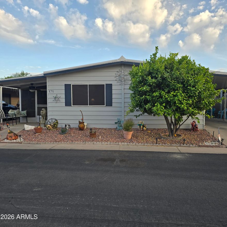 ON LEASED LAND:  MOTIVATED SELLER!!!
Fully Furnished!! Just bring your personal items. Newer furniture only a few years old. Beautiful New kitchen with all stainless steel appliances, new cabinets and counter tops. Kitchen opens to the front room and extra den area, great room feeling. New lvp flooring throughout. Primary bath has large walk in shower, new vanity. Secondary bath open to the secondary bedroom as well. Enjoy morning coffee on the screened in AZ room overlooking the walking path. Carport spaces for 2 cars and a 1 car garage or can be used as a workshop. Even lemon, tangelo and grapefruit trees. Golf cart and electric scooter.  Located in a 55 plus gated community. Pickleball, bocce ball, gym, pool, spa.  Active community.