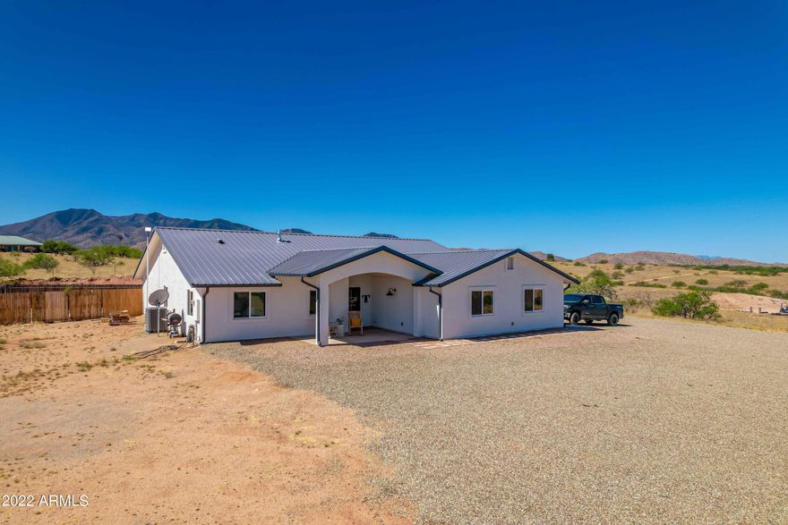This Modern Ranch Style 4 bedroom 3 bath 2286 sqft semi-custom home sits on a 4 acre lot with AMAZING panoramic views. The home includes an open floor plan concept with two master suites, 2 car garage and covered patio. Some of the features include granite counter tops throughout, wood laminate flooring, hexagon tile in bathrooms and laundry room, garden tub and walk-in shower, fireplace, metal roof, split floor plan and more! Built as a forever home, PRIDE in ownership and maticulous attention to detail.  This one won't last long!  Call TODAY!