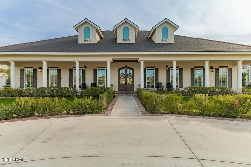 Opportunities like this rarely come along.
Welcome to Haven Groves - a true unicorn in Gilbert. An exclusive gated enclave of just seven custom homes centered around a beautiful three-acre community park with lush grass, a playground, firepit and sports court. It's the kind of neighborhood where kids play outside, neighbors gather, and life feels a little slower.

Located in South Gilbert, the home is just minutes from SanTan Village, Discovery Park, multiple hospitals, gyms, shopping, dining, and top-rated schools, offering both convenience and lifestyle in one of the East Valley's most desirable areas.

Set on a full one-acre lot with horse privileges, the home offers 5,623 square feet with 6 bedrooms, 5 full baths, and 2 half baths. A six-car garage including a massive attached RV fully insulated garage, along with a circular drive, provides exceptional space for vehicles, toys, and projects. Inside, natural light fills the home and highlights crown molding, coffered details, and warm, inviting living spaces centered around a beautiful fireplace. The kitchen sits at the heart of the home and features an imported Hallman double gas oven, pot filler, custom hood, quartz countertops, walk in pantry and generous space for cooking and gathering. Bulter's pantry with appliance station and walk through to dining room.

The layout includes a private den for work or creative space, along with guest quarters featuring its own living area and full kitchen, ideal for extended family or long-term guests.

The backyard was designed for gathering, with three sets of French doors opening to a covered patio, outdoor fireplace, sparkling pool, hot tub, and multiple seating areas. A built-in BBQ, smoker, pizza oven, outdoor pool bathroom, and outdoor shower make entertaining effortless.

The grounds are equally special, featuring an orchard with over two dozen varieties of fruit trees including blood orange, lemon, lime, grapefruit, apple, pomegranate, plum, apricot, pear, grapes, and blackberries, along with a rose garden and peaceful meditation garden.

Upgrades include two tankless water heaters, new HVAC systems in 2024, upgraded insulation, and a finished attic storage space with pull-down staircase access from the pantry.

With horse privileges, a storage/playhouse, and room to expand, build, or simply enjoy the space, this property offers the kind of land and lifestyle that's becoming harder and harder to find.

Prom photos on the front porch.
Holiday dinners that stretch late into the evening.
Kids growing up in the park down the street.
And someday, grandkids running through the backyard.

A home built for gathering.
A home designed to grow with you.
A place where the best chapters of life are still ahead.

Homes like this rarely come available in Gilbert. Welcome home.