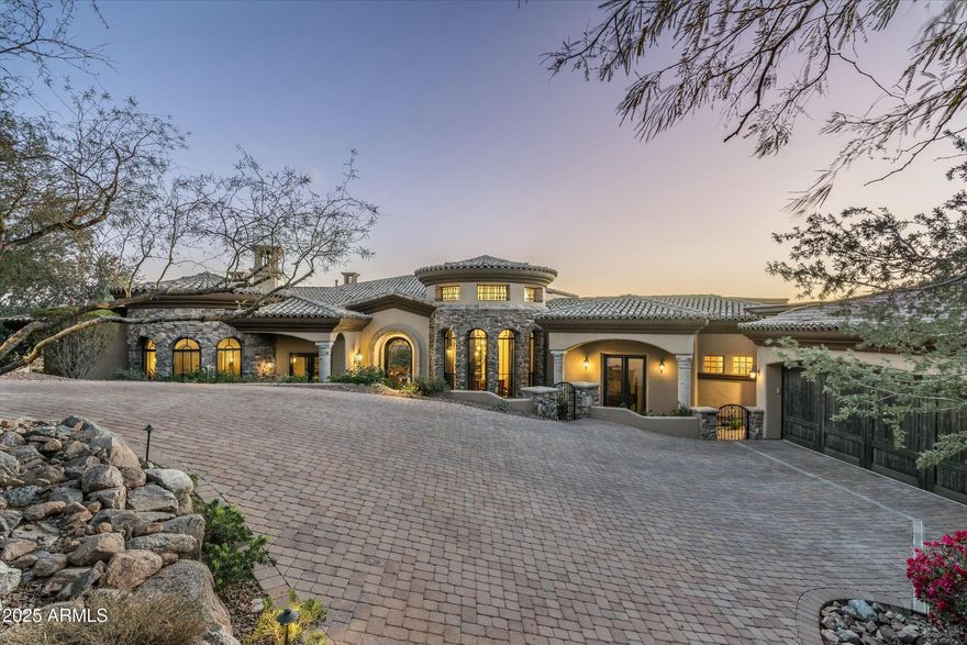 Discover the epitome of elegance and comfort in this stunning Fountain Hills residence, perfectly nestled in a prestigious gated community of Firerock. This single-level home boasts an expansive 4,688 square feet of living space, including four luxurious bedrooms and 4.5 bathrooms. Each bedroom offers its own sanctuary, with ample space and serene views. The heart of the home features a chef's kitchen, equipped with top-of-the-line appliances and an open layout that makes cooking a joyous event. 

The adjacent living areas are adorned with interior designer furnishings that blend seamlessly with the natural beauty visible through pocket sliding doors, which also provide an effortless transition to the outdoor living space. Speaking of outdoors, redefine relaxation in your own private oasis where the views are second to none. Patio features exterior heaters, outdoor television, fireplace and grilling area.

Functionality meets luxury with a split floorplan that ensures privacy for the primary bedroom while maintaining an inviting flow throughout the home. The detailed design touches and high-end finishes speak volumes of the craftsmanship invested in this property. 

Community features are just as enticing, with the Firerock Clubhouse just a stone's throw away. Target, Frys, Safeway and access to the 87 highway ensure convenience is at your doorstep. This home isn't just a place to live, it's a lifestyle waiting to be embraced. Make it yours and experience unparalleled living every day.