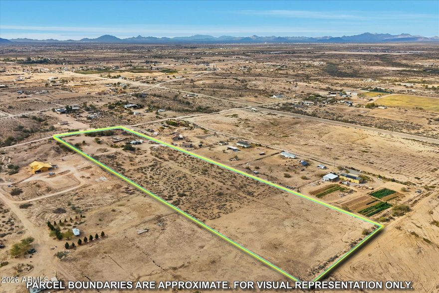 Beautiful citrus trees line the driveway of 10 acres of well groomed land that can be subdivided. 
Enjoy the wonderful views and sunsets and access to the Hassayampa River Recreation area and surrounding mountains.
 All new underground electric, NEW watering lines and a road that takes you past the steel shed that is lockable. Container does not convey.
 It has grandfathered water rights and  a well to supply all the property. The land is ready to be used as an orchard or a home for one or more families.  
A rare find in Tonopah, it sits on a bluff and is  the highest point in the area.. You must see to understand all the possibilities this could offer for investment or a wonderful place to live.
WIRED FOR R.V.
NO HOA