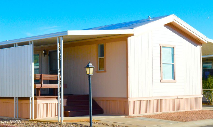 This spotlessly clean, 2 bedroom, 2 bath gem is tucked away in a desirable 55+ community in growing Casa Grande. It features a spacious open floor plan, an ample living room, dining area, & a kitchen with pantry & plenty of cabinets, all set in a soothing neutral color palette. The large master bedroom is ideal for a king size bed & it has a wall to wall closet, & a walk-in shower. The ample front & back decks are just the place for friendly gatherings. And  you get a nice, large, finished shed/workshop for all those tools and toys you just can't part with. For fencing, a row of oleanders graces the side of the carport for precious private moments. It can sell partially furnished or unfurnished.  Come by and see for yourself!  Owner is a licensed real estate agent in the state of Arizona.