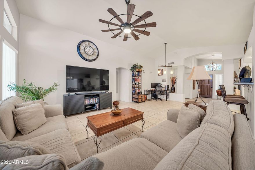 Experience Resort-style living in the heart of Sun Village -- one of Surprise's most sought-after active adult gated communities! This beautifully updated 2-bedroom, 2-bath great room floorplan offers the perfect blend of comfort, style, and vibrant community living. Step inside to soaring vaulted ceilings and an inviting open-concept design that creates an airy, spacious feel ideal for entertaining and everyday enjoyment.

The stunning kitchen was updated in 2022 and features gorgeous granite countertops, black stainless steel appliances, an incredible range oven with built-in air fryer setting, breakfast bar seating, and an adjoining breakfast room that flows seamlessly into the expansive living space. The oversized primary suite easily accommodates a king-sized bedroom set ... plus a cozy sitting area and includes a walk-in closet, dual vanity, and oversized Super shower ensuite bath. Guests will appreciate the private split-bedroom layout with a beautifully updated hall bath completed in 2019. Additional upgrades include a newer roof just 3 years ago, interior laundry, insulated garage door, and new lifetime garage spring in the spacious 2-car garage.

Step outside to your own private backyard retreat featuring a covered patio, stone pavers, flowering wall greenery, and a personal spa -- the perfect place to unwind after enjoying all the incredible community amenities. Best of all, all furnishings are available with the home, creating a truly move-in-ready opportunity!

Life in Sun Village feels like living at a private resort with guarded gate entry, scenic lakes, a par-3 golf course, pickleball, tennis and shuffleboard courts, a spectacular resort-style pool complex, clubhouse, fitness amenities, and endless social activities, clubs, and events. Conveniently located near popular Surprise attractions including Surprise Stadium, spring training baseball, shopping, dining, golf, parks, and easy access to everything the Northwest Valley has to offer.

Come discover why so many love calling this vibrant community home -- your next chapter begins here!