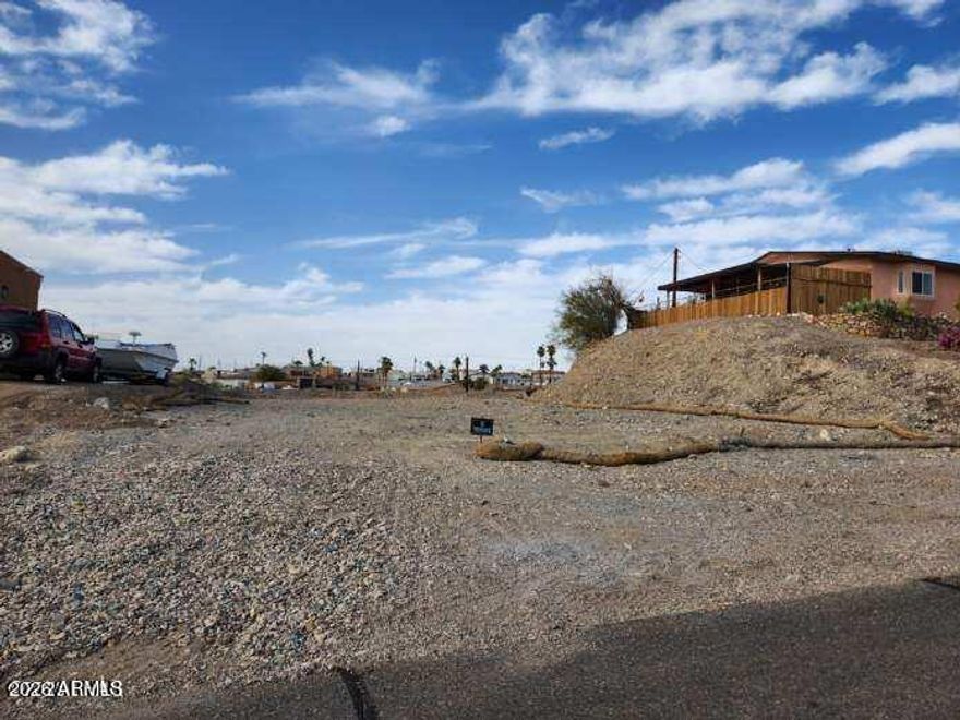 Backs up to wash - Flat, level and prepped for your dream home - this lot is ready to go! Located in a great neighborhood, you're just minutes from the lake, launch ramps and all the action. Room for a house, pool and all your toys - don't miss this great find.