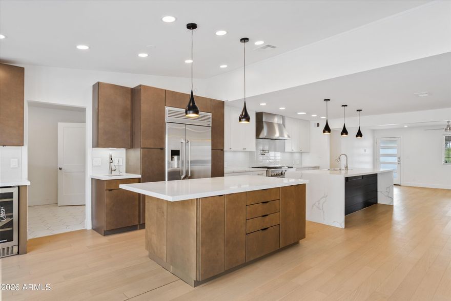 Beautifully updated home with modern finishes and a desirable open floor plan. The chef's kitchen features upgraded cabinetry, quartz countertops with waterfall edges, custom backsplash, premium appliances, and a large island perfect for gathering. The spacious primary suite offers a spa-like bathroom with dual vanities, freestanding soaking tub, walk-in shower, and custom closet. Secondary bathroom includes an updated vanity and tiled shower/tub. Situated on an expansive 1/3-acre lot with stunning mountain views, this home offers a large grassy area and extended patio ideal for entertaining. Move-in ready with style, space, and views--don't miss this opportunity!