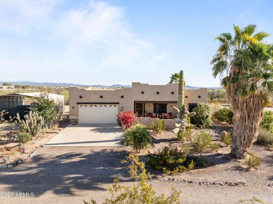 This beautifully landscaped horse property on 2 parcels totaling 2.68 acres has 4 large pipe pens, 2 with cover, and a large turn out, covered hay storage, a tack room, and 2 full RV hookups. This split-floor-plan, 3-bed, 2-bath home features a custom kitchen with an island and tile floors. This home is at the end of a quiet street of custom homes and horse properties.