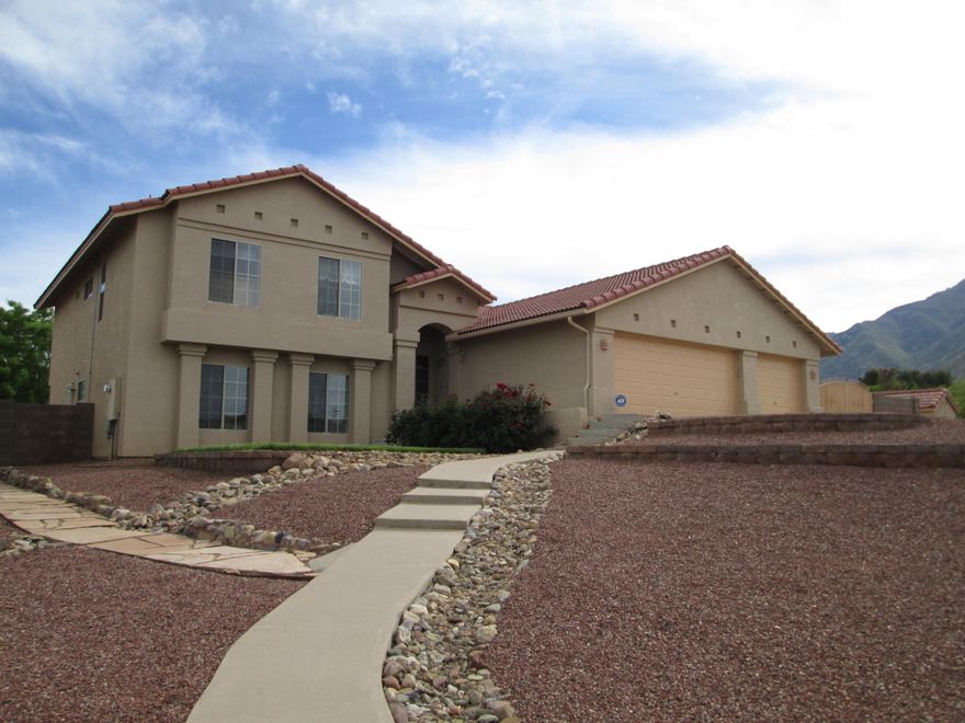 PREVIEW THIS PRISTINE IMMACULATE HOME with AMAZING MOUNTAIN VIEWS! This well maintained, multi-level single owner home has 5 bedrooms, 3 full bathrooms & a 3-car garage. UPGRADES GALORE! New dishwasher, Central vacuum system, Hardwood floors & Plush carpet, Quartz kitchen countertops, ceramic stovetop, Murphy Bed, Upgraded toilets, sink and fixtures, security system and much, much more! Enjoy serenity and peace as you sit beside the gently flowing backyard fountain or have a picnic on the beautifully manicured lawns. Tucked into the foothills of Majestic Miller Peak, this home is a MUST SEE to BELIEVE! Call for a private tour today!