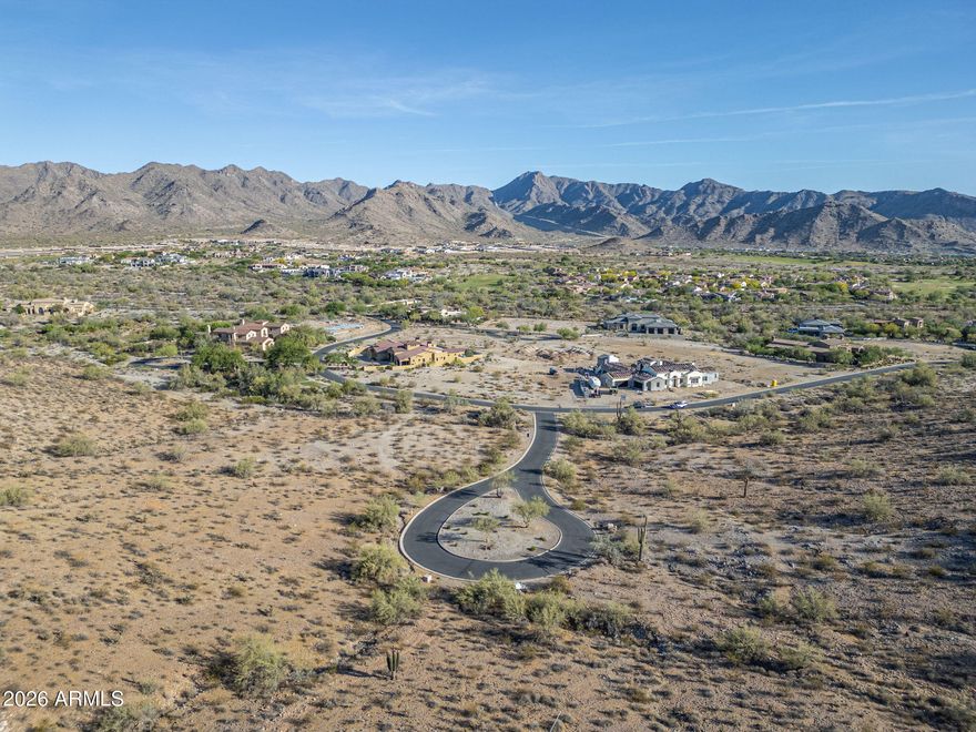 Exclusive Custom Homesite in Verrado's Prestigious custom home neighborhood This premium mountainside lot is nestled in a picturesque, tree-lined neighborhood exuding timeless charm and elegance with city light views. Enjoy breathtaking mountain views & a easy-going lifestyle just 2.5 hrs drive from skiing in Flagstaff or 3 hrs from a Mexican beach. Main Street's fine dining, boutique shopping, & lively community events are a short drive away. Verrado offers resort-style pools, fitness center, championship golf, & miles of scenic trails. Parks & lush green spaces create a serene retreat, while top-rated schools & a welcoming community make this an exceptional place to make your home. Don't miss this rare opportunity to craft a luxury residence in one of Arizona's most coveted communities