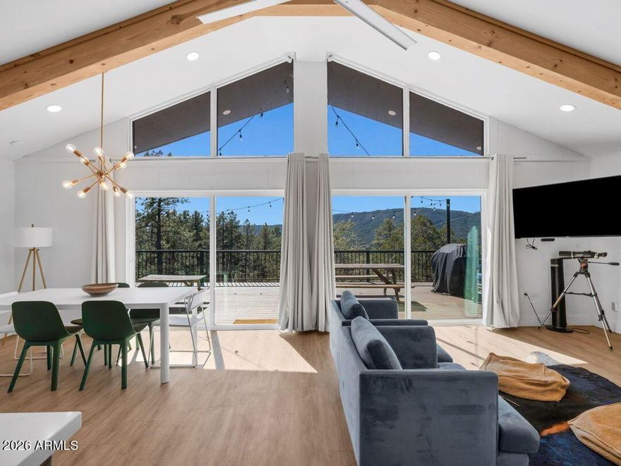 Luxury Mountain Cabin Retreat with Mogollon Rim Views | Pine, Arizona Real Estate Escape to this beautifully updated modern mountain cabin nestled on over an acre of land in the highly sought after Pine, Arizona area. This private hillside retreat offers breathtaking panoramic views of the Mogollon Rim and Pine Valley, creating the perfect blend of luxury, comfort, and nature. Step inside to discover a light-filled open-concept great room with large windows that capture the surrounding forest and expansive views. The fully equipped modern kitchen is ideal for entertaining, while the spa-like bathrooms provide a serene, upscale experience designed for relaxation. Enjoy outdoor living at its finest on the gorgeous wraparound Trex deck, perfect for taking in Arizona's stunning sunsets, cool cool mountain air, and star-filled skies. Surrounded by towering pines and bordering Tonto National Forest, this property offers unmatched privacy, tranquility, and direct access to hiking trails and outdoor recreation. Frequent visits from elk, deer, and native wildlife enhance the true mountain living experience, making this an ideal full time residence, vacation home, or income producing Airbnb investment property. Conveniently located just minutes from local restaurants, shops, and attractions, this luxury cabin in Pine, AZ combines seclusion with accessibility, enjoying the best of both worlds.