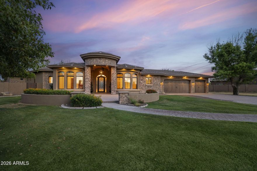 Situated at the end of a private cul-de-sac on over an acre, this custom estate zoned for horses offers six bedrooms, 4 full and 2 half baths, a finished basement, and a resort-style backyard. The 1,685-square-foot detached RV garage/workshop offers impressive ceiling height, dual roll-up doors, and a plumbed bathroom.
The chef's kitchen features granite countertops, premium appliances, a generous pantry, and extensive cabinetry.  The kitchen flows into the breakfast nook and living room anchored by a striking stone fireplace.
The primary suite features dual vanities, a jetted soaking tub and a spacious walk-in closet. 3 additional bedrooms and 2.5 baths complete the main level. The finished basement expands your  living options, with a family room, wet bar, 2 bedrooms, and a full bath.