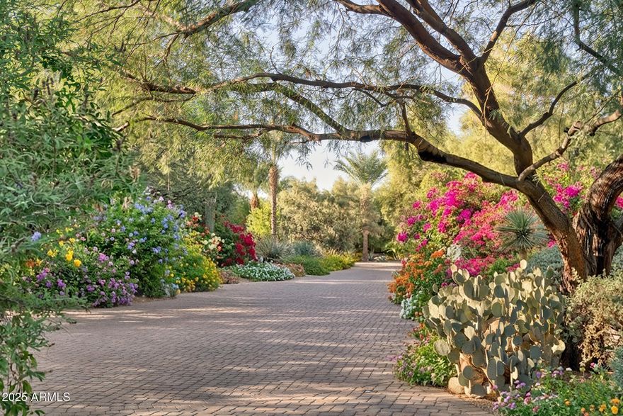 Be mesmerized walking thru your own botanical paradise, a rare ALMOST 5-acre Paradise Valley oasis nestled among other sprawling estates. A several million dollar renovation inside and out was finished in 2017. A true Territorial masterpiece with hand-laid latillas + rich beamwork, this 6 bed 8 bath 14,344 sq ft home exudes authenticity and artistry. Wood-framed glass doors open to Mummy Mtn views, lush patios, koi ponds, and meandering streams that transport you far from the city.  The property includes, a private casita, Savant smart home, heated bathrm floors, AC'd playhouse, 2-story treehouse w/ electricity, wine cellar and serene sculpture gardens. Outdoor living is elevated with bridges, lakes, greenhouse + an extensive lawn cantina perfect for events. An art collector's dream... property, it has room to showcase a large art collection. This is more than a homeit's a private botanical retreat, alive with water, light, and nature. A rare, livable work of art in the heart of Paradise Valley. Come explore... and fall in love.