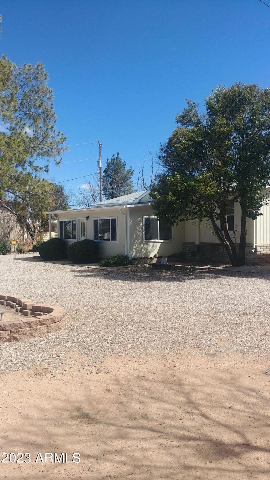 3 bedroom, 2 bath with block foundation. Enclosed front porch. Home has 2x6 walls with upgraded insulation. Corian type counters in Kitchen. Hardwood Cabinets in Kitchen. Oversized 2 car, detached garage. Approximate outside measurements of garage are 24x30. RV carport is approximately 12 foot tall, 12 foot wide and 35 long.. All on a little over half an acre in town but with a secluded setting. 3rd bedroom has base cabinets on one wall and could be used as a craft room.
