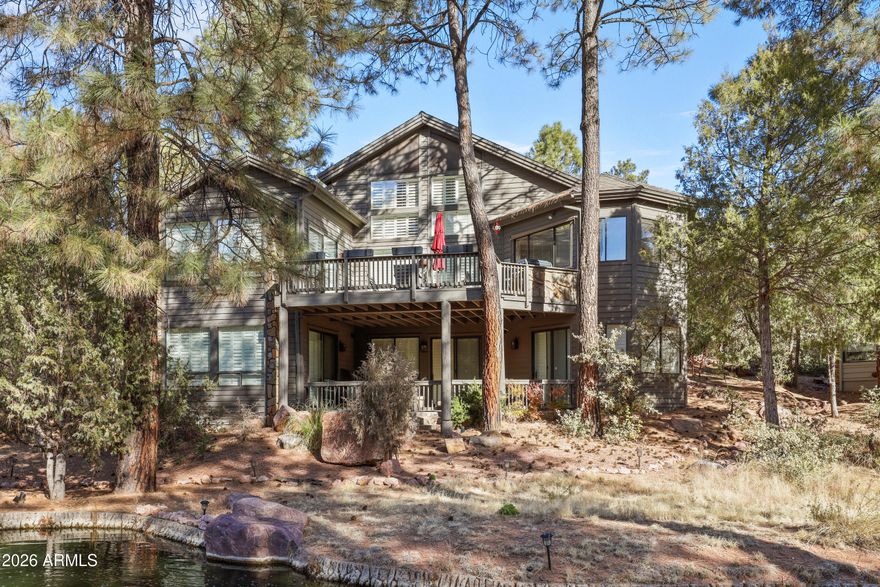 Welcome to this mountain retreat located in the highly sought-after Chaparral Pines Golf Community. Designed for both relaxation and entertaining, this spacious 4-bedroom, 4-bath home offers multiple gathering areas perfect for hosting friends and family.
Upon entering, you'll immediately notice the impressive interior wood beams accenting the vaulted ceilings, creating warmth and character throughout the main living space. Expansive windows fill the home with natural light, while plantation shutters throughout provide privacy and a cozy ambiance when desired. The main level features an open kitchen and living area that flows seamlessly onto an oversized deck complete with a built-in grill -- ideal for outdoor dining and enjoying the mountain setting, featuring views of the golf course and multiple water features.
Downstairs, a second large living area provides additional space for entertaining, featuring its own bar area along with two additional bedrooms, including a secondary master suite. Step outside to a walkout patio where tranquil water features create a peaceful outdoor escape. This home offers a wonderful opportunity to add your personal style and modern touches while enjoying its great layout and location.
A combination of comfort, space, and mountain charm -- perfect as a full-time residence or getaway retreat. Easy to Show.