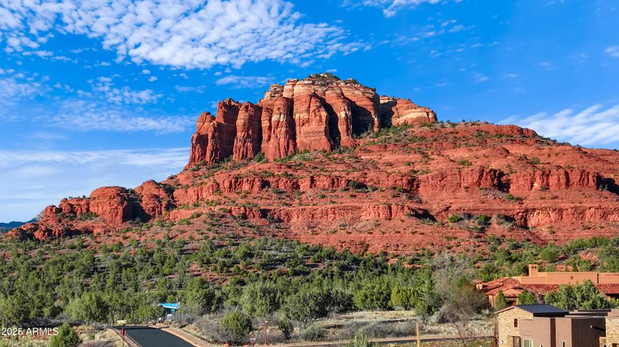 Experience tranquility, luxury, and the freedom to exhale at this custom building site in the prestigious gated community of CR Ranch. Most homes in this neighborhood are valued at $2+ million. Situated in a quiet, coveted cul-de-sac, experience jaw dropping vistas of Cathedral Rock, Seven Warriors, and Thunder Mountain from this unparalleled location. This expansive lot is one of the largest available, offering uninterrupted views of the vibrant red rock formations and plenty of elbow room from the neighboring homes/lots. This lot boasts 1.39 acres of flat, easily buildable terrain, where privacy is abundant for this ideal canvas for your dream home. Located in the sought-after Village of Oak Creek area, residents have access to an array of amenities including fine dining, hiking trails, golf courses, boutique shopping, and thriving art galleries. This exceptional property must be experienced firsthand to fully appreciate - photos simply don't do it justice. A boundary survey is available with Utilities installed at the lot lines.