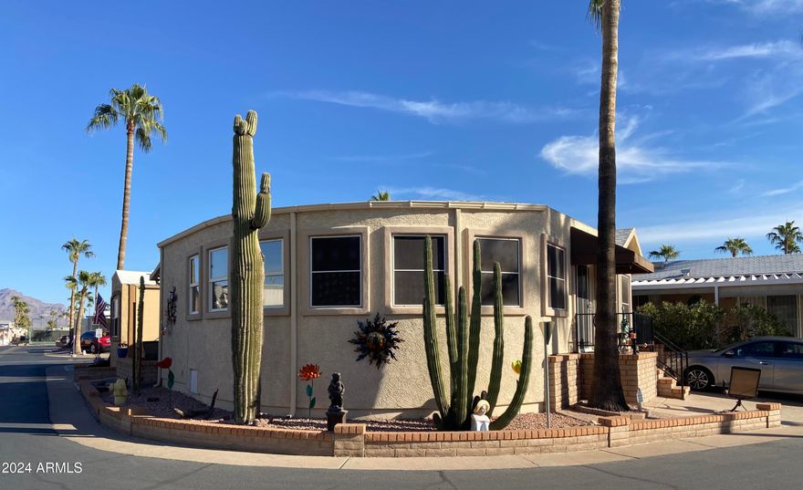 These don't come on the market often! Stucco exterior and a corner lot location with mountain views from the back patio! Inside laundry, spacious Arizona room and a second bedroom/office. Sunrise and sunset views, everything is on one level (no interior steps) Room to park multiple vehicles and outdoor storage. Retirement living at it's very best in this 55+ golf course resort with endless amenities including an onsite restaurant, lap pool, play pool, and therapy pool, up to date exercise center, 2 spas, pickleball, tennis, bocce ball ... the list goes on. Free park tours daily.