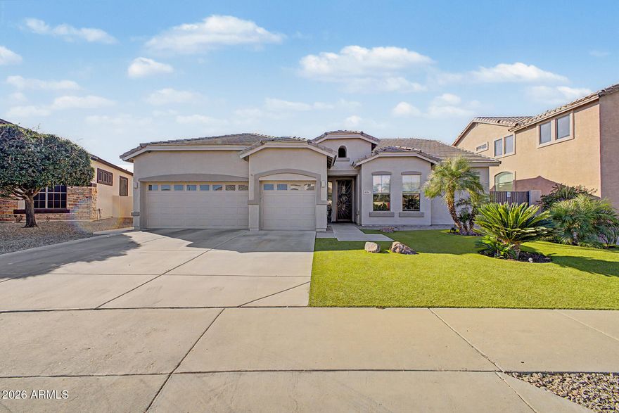 Beautiful 4 Bed/2 Bath Glendale Home with Large Premium Greenbelt Lot is for sale in the desirable Rovey Farms Estates. Minutes from Westgate Entertainment District, Cardinals Stadium, Cabelas and Desert Diamond Casino offering a multitude of activities, dining & shopping. This spacious single story home features 10' Ceilings, 4-Car Garage w/ Mini Split System and Epoxy Floor, Formal Dining or use as a Flex Room for Home Office, inviting-Open Concept Great Room w/ a Updated Gourmet Kitchen featuring Quartz Countertops, Double Stainless Steel Electric Ovens, Gas 6 Burner Cooktop and a Large Breakfast Nook. The lush low maintenance Artificial Turf front yard that stays green and inviting year round. The backyard is a DREAM! Amazing 40' Covered & Tiled Patio, Heated Pool & Tiled Outdoor Kitchen, dedicated covered BBQ area perfect for entertaining. Front and Backyard have well established plants along with 3 Fruit trees. Home is freshly painted exterior 2 months ago. Double utility gate to store the boat, kayaks & more! Both A/C Units and Gas Hot Water Heater costing over $23,000 have been replaced within the last 2 years with Parts Warranty. No Carpet, has 20" Porcelain Tiles throughout the home and Laminate Flooring in the Bedrooms and Flex Room. The Great Room, Breakfast Nook and Master Bedroom adds the "WOW"factor when you enter the Home with views of the Backyard and Pool. Minutes from the 101 Freeway. A block away from Raymond Kellis High School. This is a must see house!